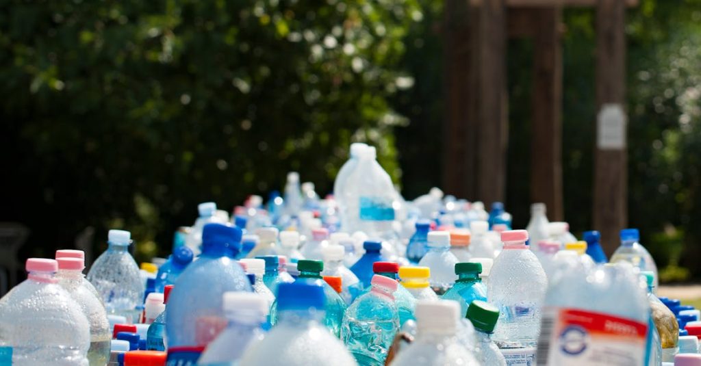 A vibrant collection of plastic bottles in an outdoor recycling setup, showcasing environmental awareness.